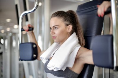 Woman working out on a machine at the gym